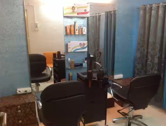 Makeup artist preparing professional cosmetics at Kalosine salon in Baner